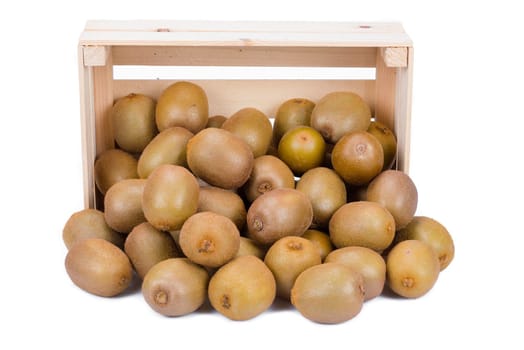 Wooden box with many ripe kiwi fruits in front of it isolated on white background