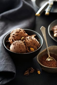 Homemade Organic chocolate Ice Cream scoops decorated with chocolate sprinkles