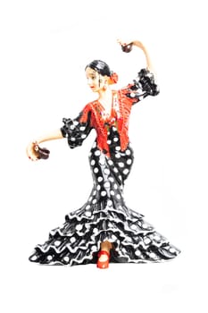 Spanish flamenco dancer. Close-up of woman dancing flamenco in traditional costume. Ceramic figure.