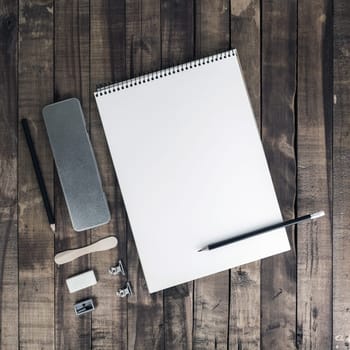 Blank corporate stationery template on vintage wood table background. Branding mock-up. Flat lay.