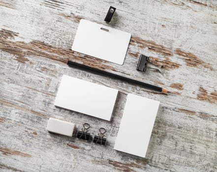 Blank stationery set on wood table background. Responsive design template. Flat lay.