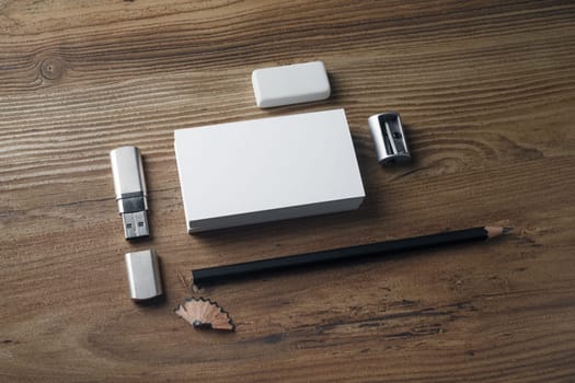 Photo of blank stationery set on wood table background. Corporate identity mockup. Responsive design template.
