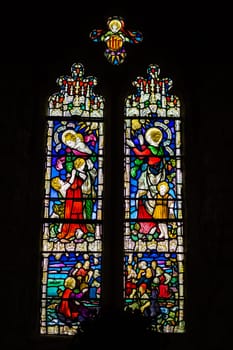 Marazion, England -  May 2018 : Victorian stained glass church window in St Michael`s Mount castle chapel, depicting saints and various religious scenes, Cornwall, UK
