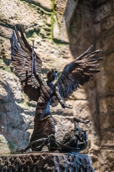 Marazion, England -  May 2018 : Sculpture depicting angel killing demon or devil in St Michael`s Mount castle chapel, Cornwall, UK