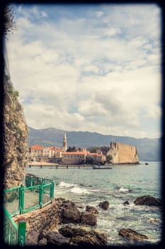 Budva, Montenegro - April 2018 : Panorama of the coastal pathway on the Budva Adriatic coast and Old Town, Montenegro