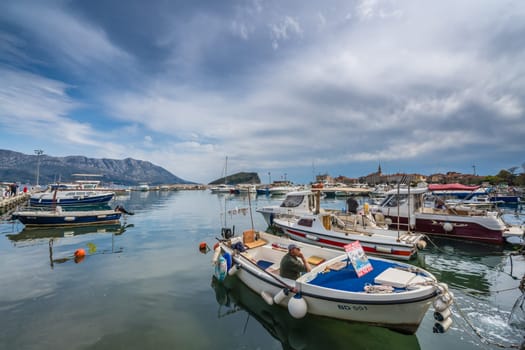 Budva, Montenegro - April 2018 :  Yachts and boats moored in the port in Budva town