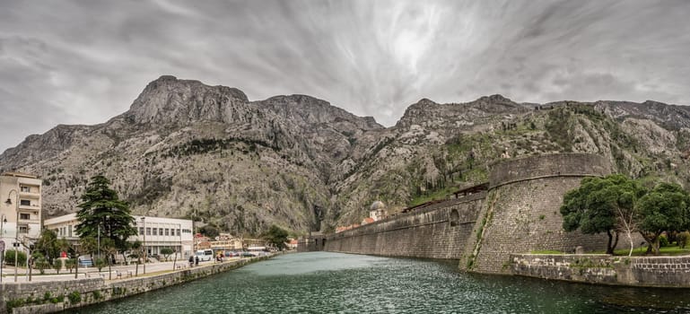 The massive walls of the fortification Bastion Riva by the river Shkurda in Kotor Old Town, Montenegro