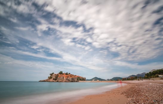 Sveti Stefan, Montenegro - April 2018 :  Beach in front of the historical old town, currently privately owned and turned into an expensive luxury hotel