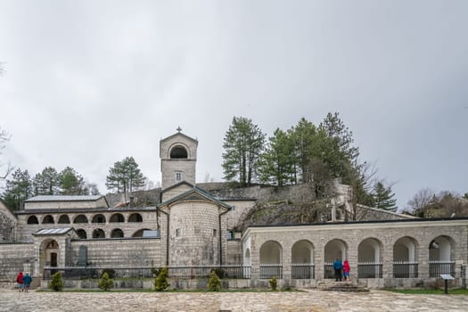 Cetinje, Montenegro - April 2018 : People in front of the ancient Monastery of the Nativity of the Blessed Virgin Mary