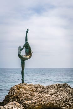 Budva, Montenegro - April 2018 :  The statue of Ballerina Dancer, standing on the rock, Budva landmark, Montenegro