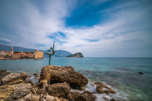 Budva, Montenegro - April 2018 :  The statue of Ballerina Dancer, standing on the rock, Budva landmark, Montenegro