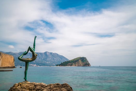 Budva, Montenegro - April 2018 :  The statue of Ballerina Dancer, standing on the rock, Budva landmark, Montenegro