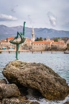 Budva, Montenegro - April 2018 :  The statue of Ballerina Dancer, standing on the rock, Budva landmark, Montenegro
