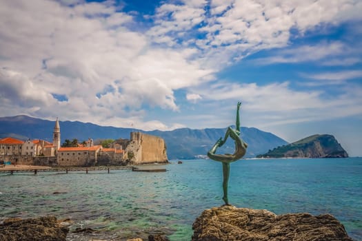 Budva, Montenegro - April 2018 :  The statue of Ballerina Dancer, standing on the rock, Budva landmark, Montenegro