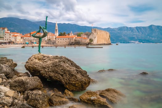 Budva, Montenegro - April 2018 :  The statue of Ballerina Dancer, standing on the rock, Budva landmark, Montenegro