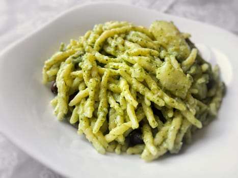 Italian trofie pasta with traditional pesto sauce. Restaurant and food concept