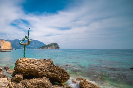 Budva, Montenegro - April 2018 :  The statue of Ballerina Dancer, standing on the rock, Budva landmark, Montenegro
