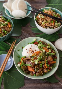 Chinese food with beef, rice and veggies