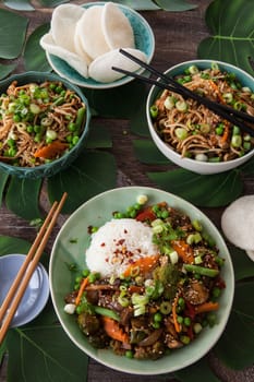Chinese food with beef, rice and veggies