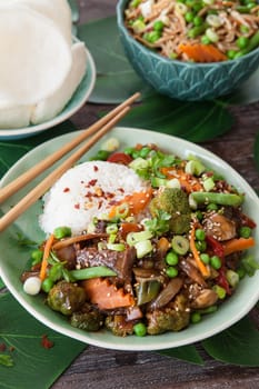 Chinese food with beef, rice and veggies