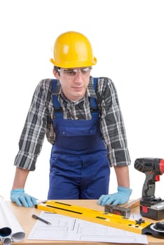 young worker works at his desk on the white background