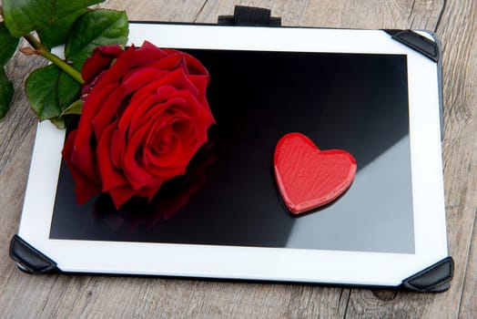 digital tablet with a rose and heart for valentine day