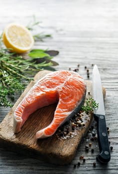 Slices of red salmon fish with spices. Prepare for cooking meal.
