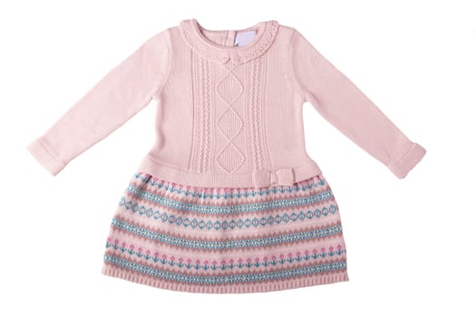 Clothes for children. A beautiful pink bright girl dress with colorful pattern isolated on a white background. Children fashion.