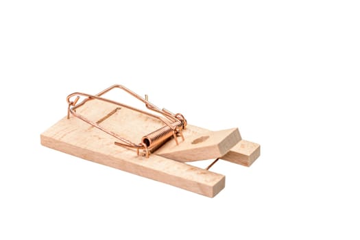 Small cocked wooden mousetrap isolated on white.