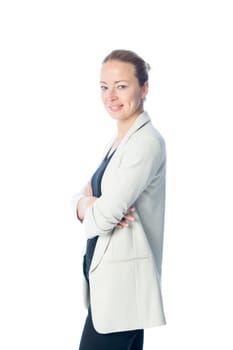Full body side portrait of casualy dressed,cheerful, beautiful, smart, young businesswoman in standing with arms crossed against white background.