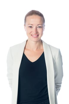 Portrait of casualy dressed,cheerful, beautiful, smart, young businesswoman in standing against white background.