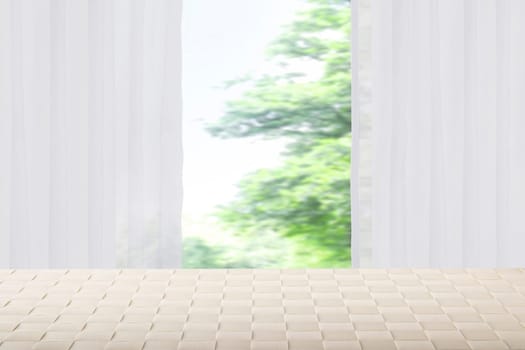 Empty bright table in front of blurred curtain window natural green background. Template for your product display montage. Space.