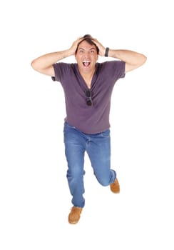 A screaming young man running of frustration about the news he .heard, isolated for white background.