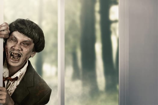 Creepy zombie man come into abandoned house. Halloween concept