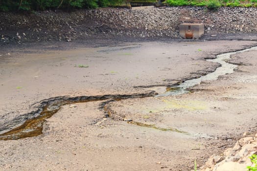 Dried and cracked soil in a dried-up riverbed