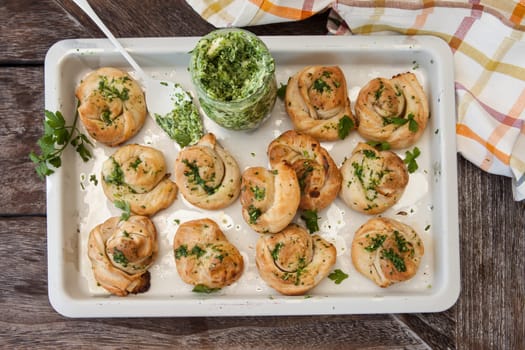 Savoury snack made from puff pastry with garlic herbal butter