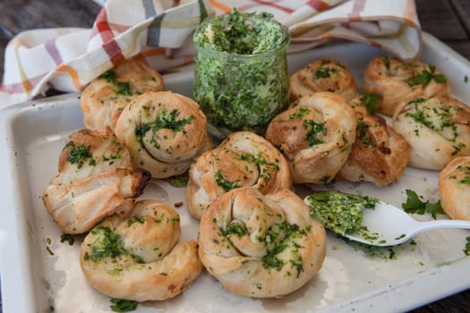 Savoury snack made from puff pastry with garlic herbal butter