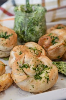 Savoury snack made from puff pastry with garlic herbal butter