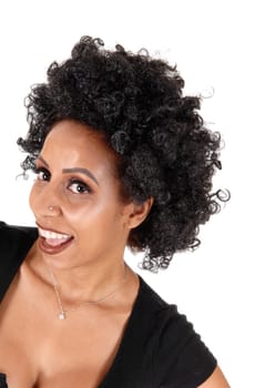 A lovely young woman in a portrait with very fussy curly black hair.laughing with her mouth open, isolated for white background.