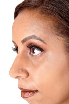 The face in a close-up shot of a young woman with her big eyes and.dark red lips, looking strait, isolated for white background.