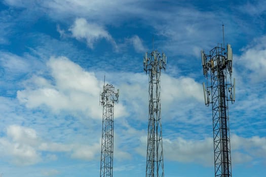 Mobile phone communication tower transmission  signal with blue sky background and antenna