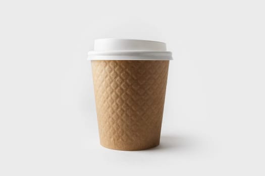 Blank kraft paper coffee cup with cap. Disposable cup