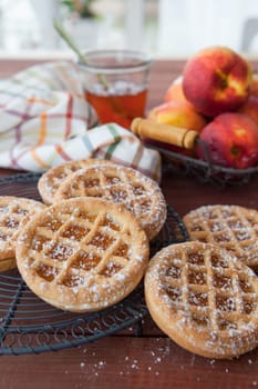 Little pies made from short crust and peach jam