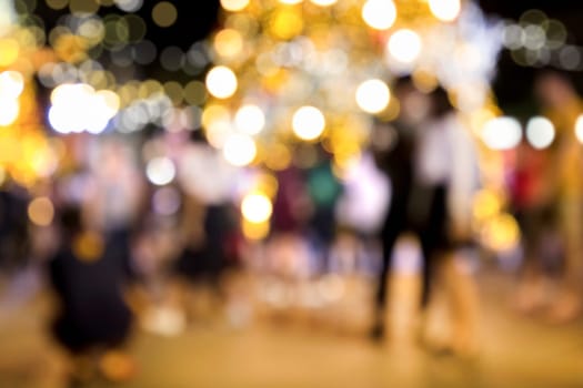 Conceptual abstract background image of defocused Christmas decoration on city street at night