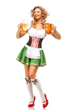 Creative concept photo of Oktoberfest waitress wearing a traditional Bavarian costume with beer isolated on white background.