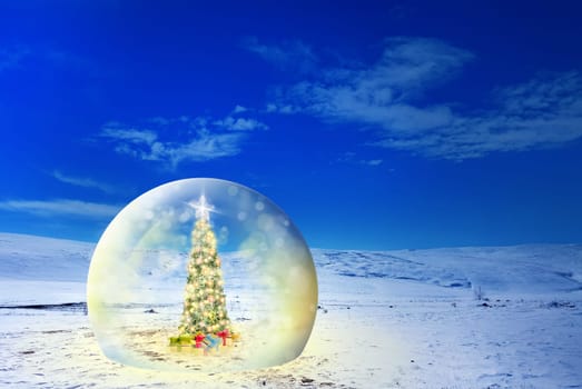 Conceptual image of decorated Christmas tree with colorful lights and ornaments in glass sphere on snow covered landscape