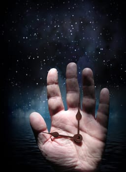 Hand with clock. Starry sky