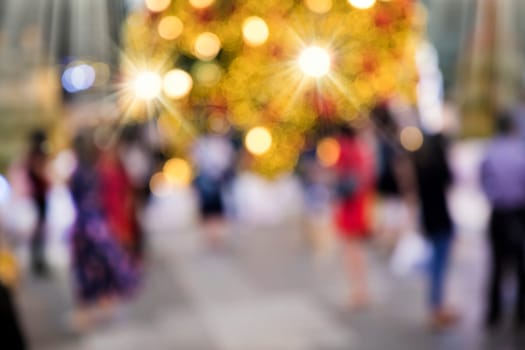 Conceptual abstract background image of defocused Christmas decoration on city street at night
