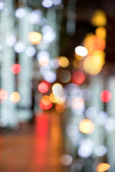 Blurry background image of defocused colorful abstract city street lights at night