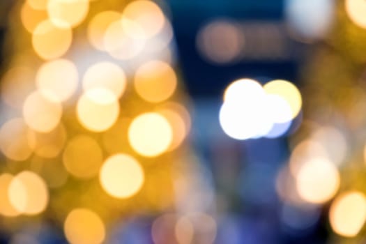Blurry background image of defocused yellow abstract city street lights at night